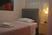 Łóżko lub łóżka w pokoju w obiekcie Alexandra's Relaxing Suite