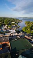 an aerial view of a city with a tennis court at Hôtel Expérience - Quartier Des Marinas in Magog-Orford