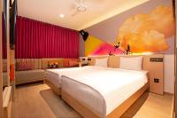 a bedroom with a bed and a couch at Ginger Pondicherry in Puducherry