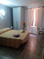 Posteľ alebo postele v izbe v ubytovaní Casa vacanze su sorighe.