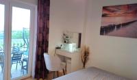 Postel nebo postele na pokoji v ubytování Apartment Natali