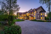 a large estate with a cobblestone driveway at Malachit Karpacz SPA Hotel in Karpacz