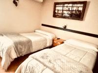 Posteľ alebo postele v izbe v ubytovaní Hotel Hospederia Zacatin