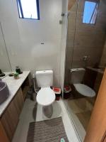 a bathroom with a toilet and a sink and a shower at Villas do Porto APTO 05 - Porto de Galinha in Porto De Galinhas