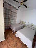 Postel nebo postele na pokoji v ubytování Apartamentos Turisticos Paraíso Andaluz