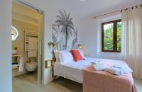 A bed or beds in a room at Villa Morro Suites