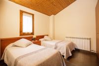 Posteľ alebo postele v izbe v ubytovaní Apartamentos Cal Rum