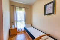 Postel nebo postele na pokoji v ubytování RAB CENTAR DUE