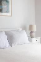 A bed or beds in a room at Villa Zanetti Mykonos