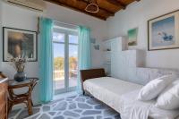 A bed or beds in a room at Villa Zanetti Mykonos