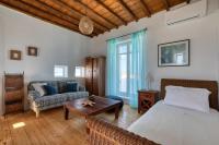 A bed or beds in a room at Villa Zanetti Mykonos