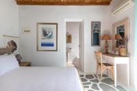 A bed or beds in a room at Villa Zanetti Mykonos