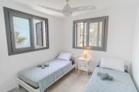 Postel nebo postele na pokoji v ubytování Meneou Blu Beach House*