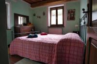 A bed or beds in a room at Agriturismo Biagiotti