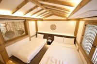 Ein Bett oder Betten in einem Zimmer der Unterkunft Hanok Hotel DAAM Seoul