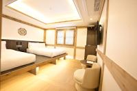 Ein Bett oder Betten in einem Zimmer der Unterkunft Hanok Hotel DAAM Seoul