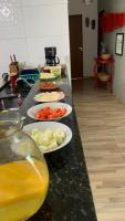 a row of plates of food on a counter at Pousada QUERÊNCIA FRANCÊS in Marechal Deodoro