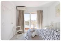 A bed or beds in a room at La CASA en La Carihuela playa a 4 minutos a pie