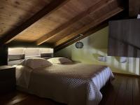Postel nebo postele na pokoji v ubytování Asikiko Suites
