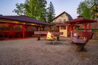 a fire pit with benches in front of a building at Malachit Karpacz SPA Hotel in Karpacz