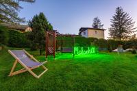 a playground with a green sign in the grass at Malachit Karpacz SPA Hotel in Karpacz