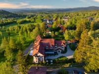 an aerial view of a large house in the woods at Malachit Karpacz SPA Hotel in Karpacz