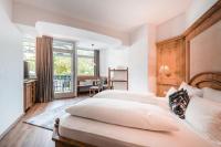 Posteľ alebo postele v izbe v ubytovaní Hotel Erika
