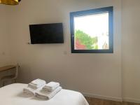 La Maison Blancheにあるテレビまたはエンターテインメントセンター