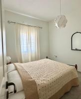 Posteľ alebo postele v izbe v ubytovaní Demetra House by Elefthia Syros