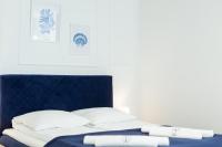 Posteľ alebo postele v izbe v ubytovaní Apartament 1B Niebieskie Apartamenty Poddąbie dawniej Blue Marine z basenem krytym, odkrytym, salą zabaw, animacjami