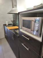 A kitchen or kitchenette at La Martela de Fuentes Casa de diseño rural