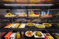 a display case filled with lots of different types of food at CitiGO Hotel Yuexiu Ouzhuang MTR Station Ghuangzhou - Free shuttle between hotel and Exhibition Center during Canton Fair in Guangzhou