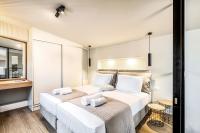 Posteľ alebo postele v izbe v ubytovaní Tereza's Sunset Hotel