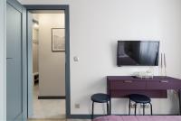 Televízia a/alebo spoločenská miestnosť v ubytovaní Apartament nad morzem