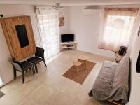 Telewizja i/lub zestaw kina domowego w obiekcie Bel Appartement Duplex