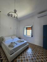 A bed or beds in a room at Terra Muronis Hotel Diffuso