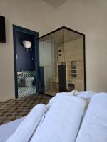 A bed or beds in a room at Terra Muronis Hotel Diffuso