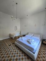 A bed or beds in a room at Terra Muronis Hotel Diffuso