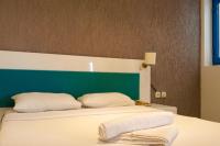 Postel nebo postele na pokoji v ubytování One More Day Hotel