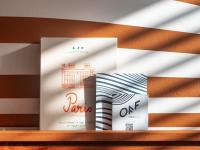 three books sitting on top of a shelf at Hotel OFF Paris Seine in Paris