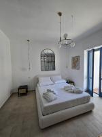 A bed or beds in a room at Terra Muronis Hotel Diffuso