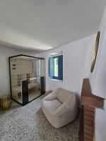 A television and/or entertainment centre at Terra Muronis Hotel Diffuso