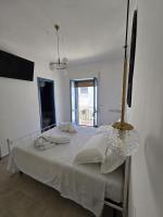 A bed or beds in a room at Terra Muronis Hotel Diffuso