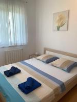 Posteľ alebo postele v izbe v ubytovaní Apartments Marinela