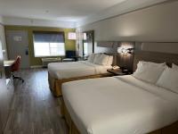 a hotel room with two beds and a desk at Holiday Inn Express Hotel & Suites San Dimas by IHG in San Dimas