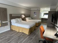 a hotel room with two beds and a television at Holiday Inn Express Hotel & Suites San Dimas by IHG in San Dimas