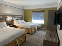 a hotel room with two beds and a flat screen tv at Holiday Inn Express Hotel & Suites San Dimas by IHG in San Dimas
