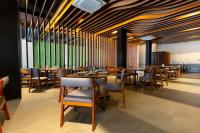 Un restaurant u otro lugar para comer en Hotel Noite Business Class