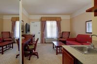 a living room with a kitchen and a living room with a couch at Holiday Inn Express Hotel & Suites San Dimas by IHG in San Dimas