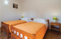 Posteľ alebo postele v izbe v ubytovaní Holiday Home Povlja With Sea View I